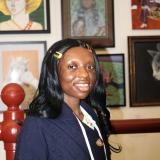 DarlynViolet Njoroge, the Winner of the 2025 Congressional Art Competition for Maryland’s 7th Congressional District, in front of her piece entitled “My True Self (My Mother’s Rose)”