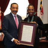 Congressman giving an acknowledgement to someone in his office. 