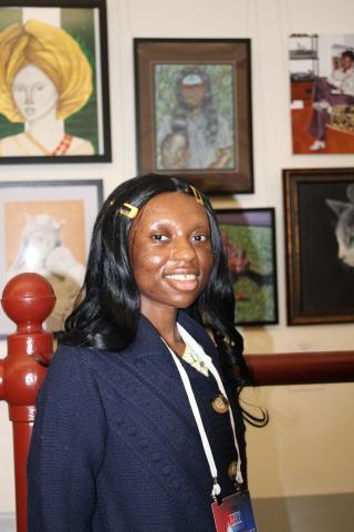 DarlynViolet Njoroge, the Winner of the 2025 Congressional Art Competition for Maryland’s 7th Congressional District, in front of her piece entitled “My True Self (My Mother’s Rose)”